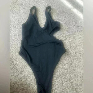 Black one piece bathing suit.